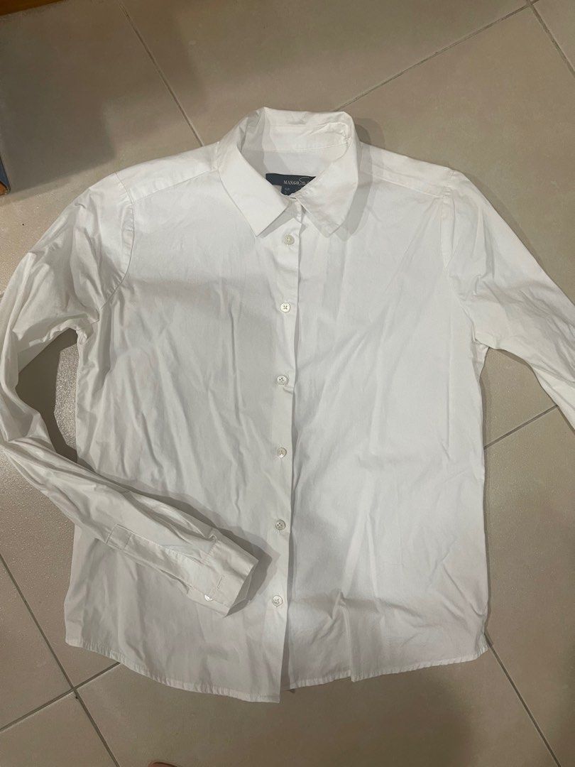 Mango white short button down (Category: Blouses) located in Taguig. Submitted by wildbiteph (Listing ID 1368465300, Image 1). Description: .