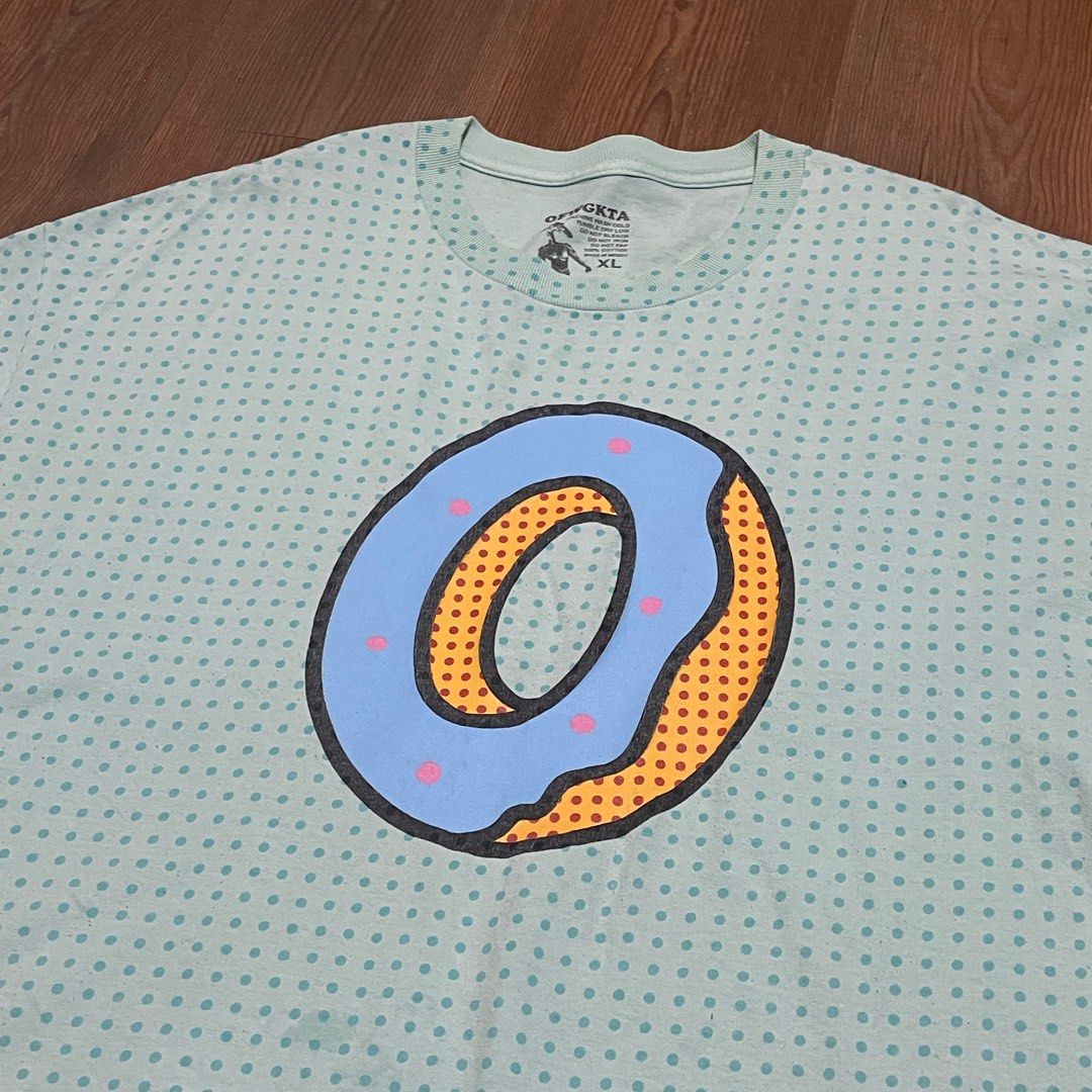 ODD FUTURE (Category: Tshirts & Polo Shirts) located in Dengkil. Submitted by 4nipcloset (Listing ID 1368563082, Image 3). Description: ODD FUTURE “Donut” Tees * OG before GOLF WANG * Made in Mexico Materials : 100% Cotton * Kain tebal + tahan lasak Condition : 8.5/10 * Graphic cracking sikit * Colour still perfect * Bebas koyak Size : Oversize XL Pit : 23”, Length : 30”.