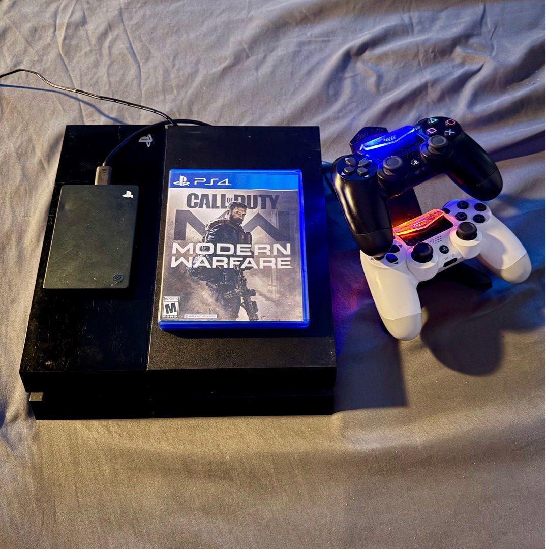 PS4 Phat 500gb + 2 controllers + 2TB External Drive (4 games) (Category: PlayStation) located in Pasig City. Submitted by robbiseraphin (Listing ID 1368574199, Image 1). Description: Selling: Phat 500gb 💯 Inclusives: - 2 OEM controllers - 2TB External drive with 3 games (Resident evil 4,5,6) - 1 CD (Call of Duty: Modern Warfare 2019) - Power chord wire - Controller charging station - Latest Firmware - Warranty sticker intact = 6k Items are in Pa