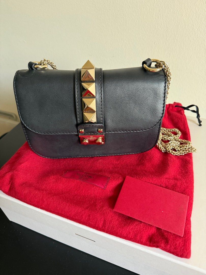 Valentino Rockstud Bag Small (Category: Bags & Wallets) located in Singapore. Submitted by funkyfinds001 (Listing ID 1368462454, Image 1). Description: Well-loved with minor wear; faint scratch barely noticeable. Stylish, versatile, and perfect for any evening look! PM for fast deal .