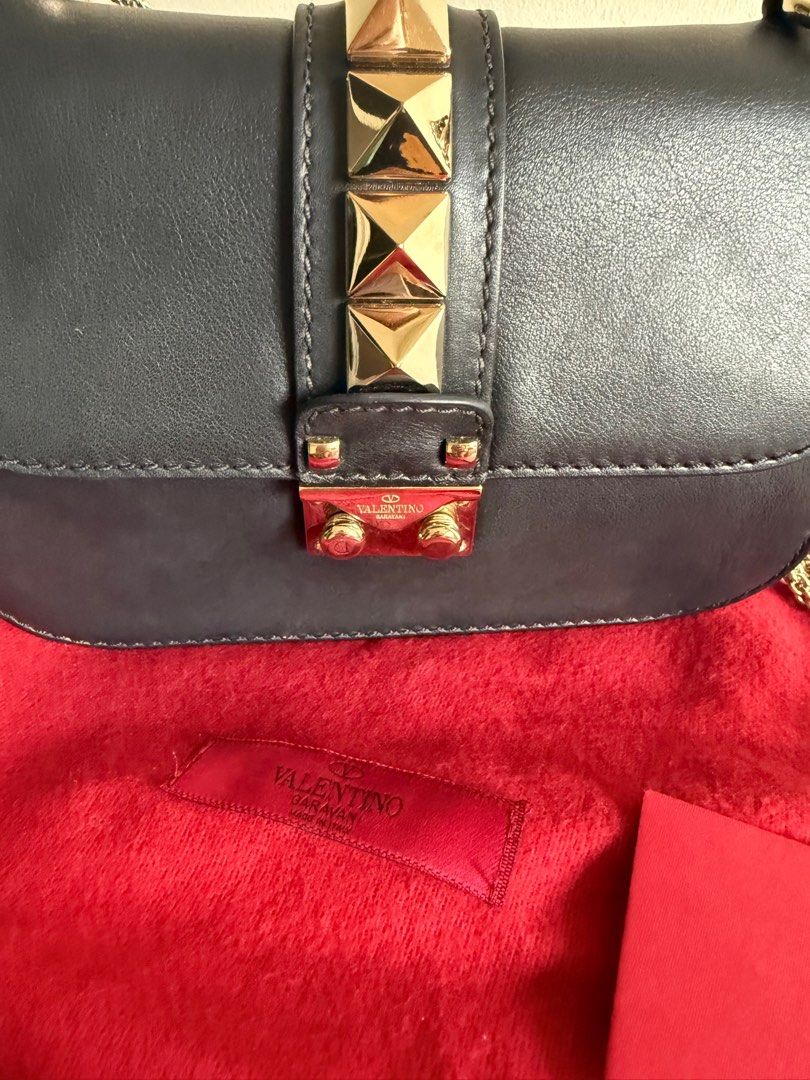 Valentino Rockstud Bag Small (Category: Bags & Wallets) located in Singapore. Submitted by funkyfinds001 (Listing ID 1368462454, Image 3). Description: Well-loved with minor wear; faint scratch barely noticeable. Stylish, versatile, and perfect for any evening look! PM for fast deal .