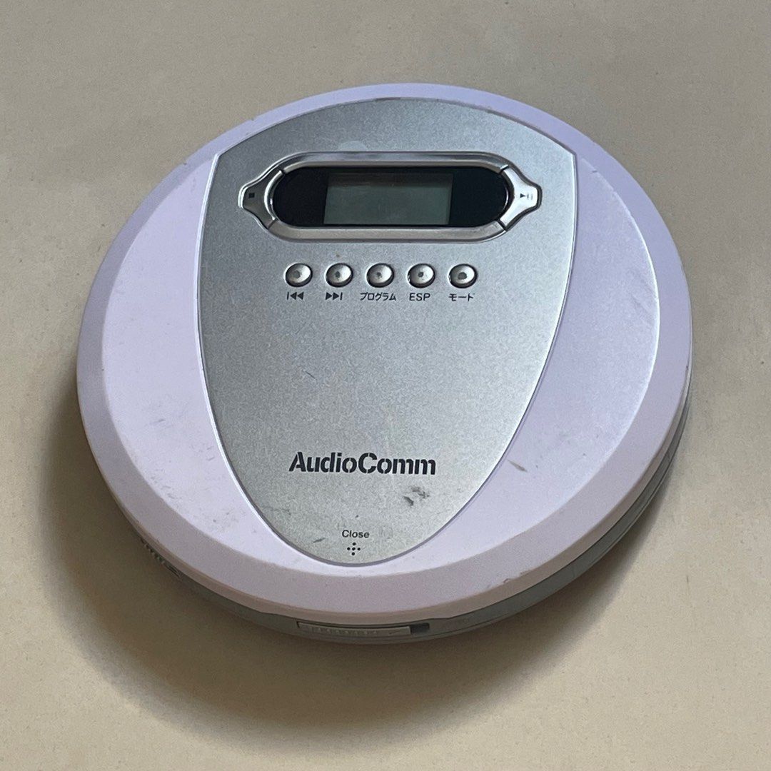 AudioComm CD player discman white and silver (Category: Portable Music Players) located in Singapore. Submitted by e.gadgeteer (Listing ID 1368585737, Image 1). Description: Tested and working, can play music CDs..