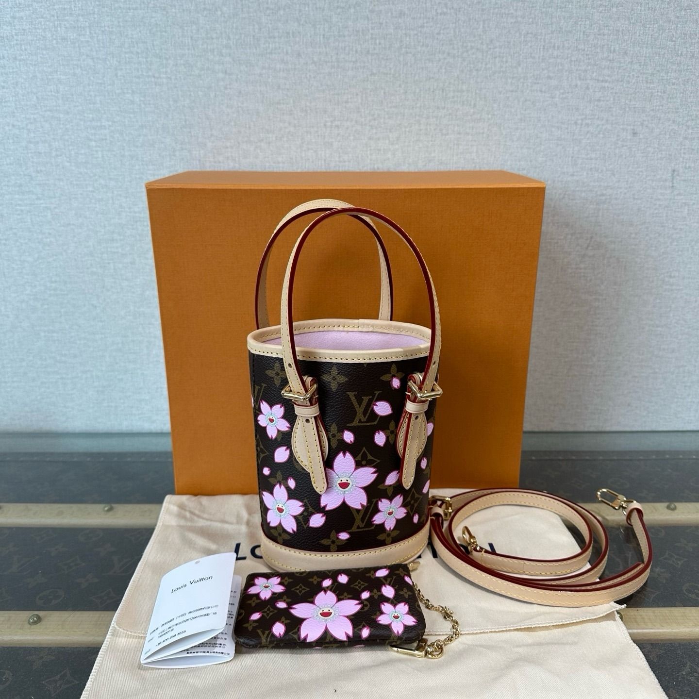 Louis Vuitton X Takashi Murakami Nano Cherry Blossom Bucket Bag (Category: Bags & Wallets) located in Singapore. Submitted by projectlfg (Listing ID 1368677339, Image 2). Description: Louis Vuitton X Takashi Murakami Nano Cherry Blossom Bucket Bag Condition 98% New. Year: Chip Model Accessories: Box, dust bag, booklet Item code: 3102503311880 Size: 13x19x7 / SGD: 4324 / 13518500 • ACRA Registered Company in Singapore • Physical Outlets in Singapo