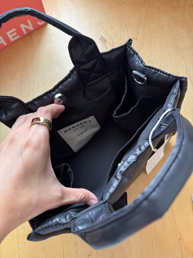 Marhen.J Rico Mini Padding Bag (Category: Cross-body Bags) located in Mandaluyong City. Submitted by ellasellstuff (Listing ID 1368622616, Image 2). Description: Brand new, bought in Korea Retails at P5,500 RICO MINI bag in a limited Padding edition. A crossbody bag made of padded material with a simple design and water-resistant functionality. The front label detail adds a casual touch, while the side pockets on both sides offer convenient stora
