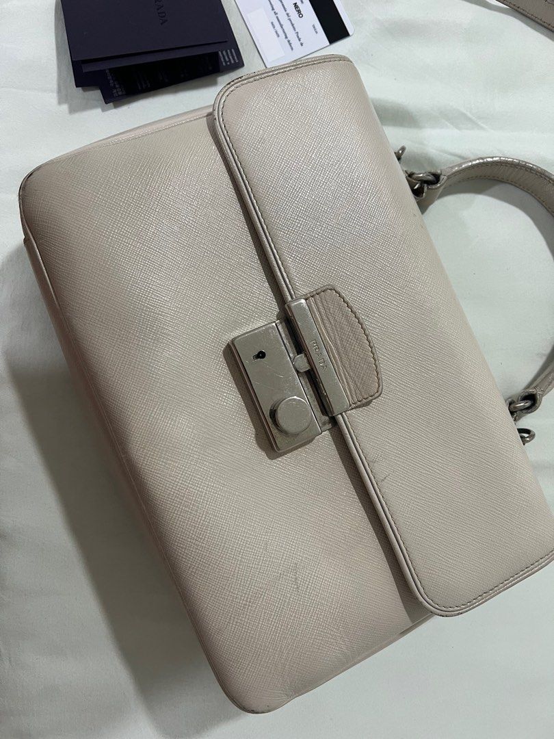 PRADA - Crossbody bag in cream (Category: Luxury Bags & Wallets) located in Quezon City. Submitted by shopsecondfits (Listing ID 1368720215, Image 2). Description: all flaws seen on pic negotiable.