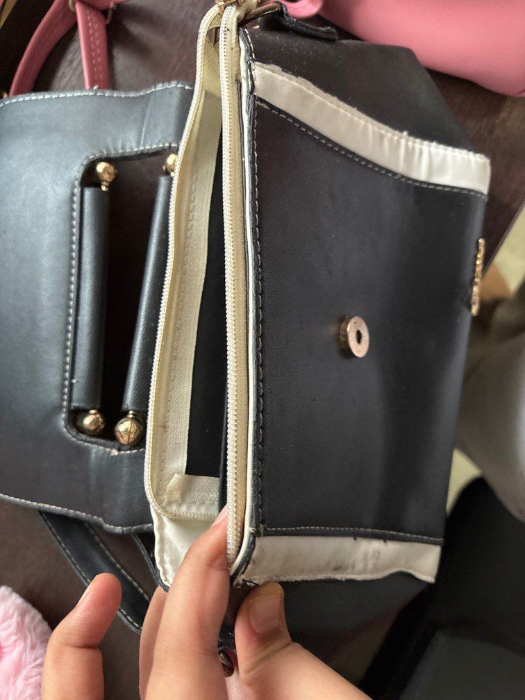 Purses (Category: Purses & Pouches) located in Singapore. Submitted by sonyatimes94361 (Listing ID 1368645193, Image 3). Description: Very nice purses The black and white one is slightly torn just a bit as shown in pic - selling for $5 The pink and white one is like new - selling for $10.