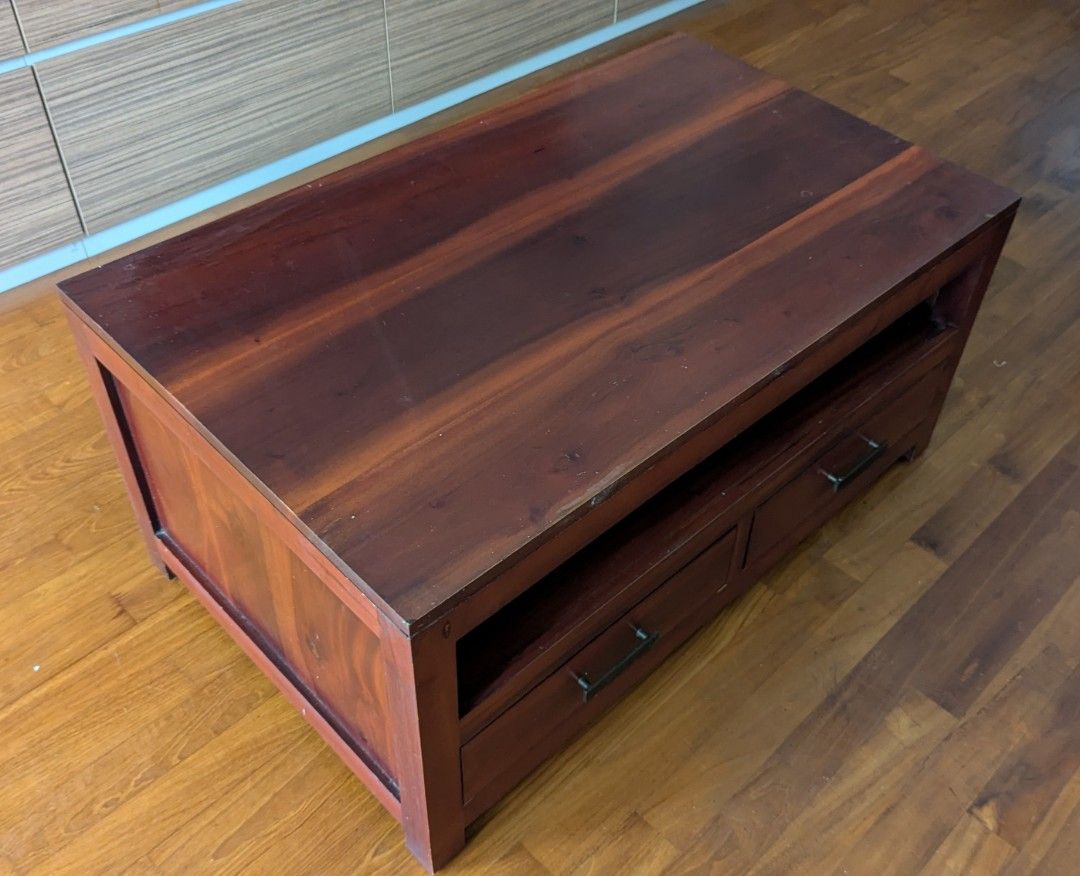Solid Teak Coffee Table (Category: Tables & Sets) located in Singapore. Submitted by ouaisman (Listing ID 1368613325, Image 2). Description: Teak coffee table with 4 drawers (2 on each side), condition 9/10. Have a matching TV console as well if you want (check my listing? L100xW60xH47 Bought a few years ago for SGD 499..