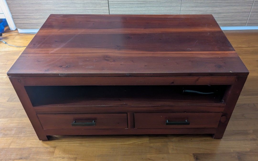 Solid Teak Coffee Table (Category: Tables & Sets) located in Singapore. Submitted by ouaisman (Listing ID 1368613325, Image 1). Description: Teak coffee table with 4 drawers (2 on each side), condition 9/10. Have a matching TV console as well if you want (check my listing? L100xW60xH47 Bought a few years ago for SGD 499..