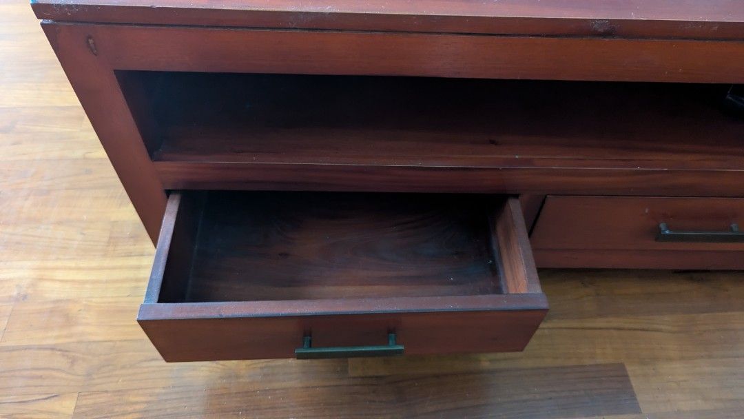 Solid Teak Coffee Table (Category: Tables & Sets) located in Singapore. Submitted by ouaisman (Listing ID 1368613325, Image 3). Description: Teak coffee table with 4 drawers (2 on each side), condition 9/10. Have a matching TV console as well if you want (check my listing? L100xW60xH47 Bought a few years ago for SGD 499..