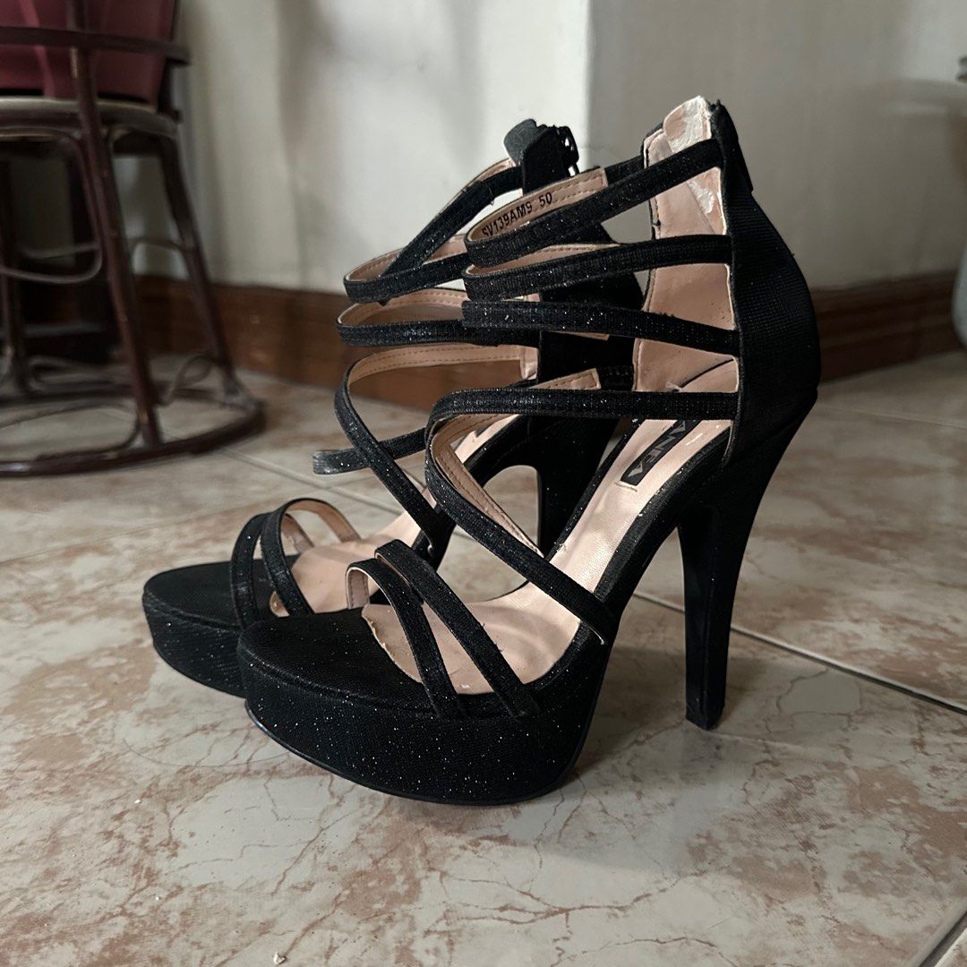 Black platform heels (Category: Heels) located in Cebu City. Submitted by bcdeclutters (Listing ID 1368831670, Image 1). Description: Bought for 1800 Brand: Zanea Size: US 5 Heel height: 4 in Only used once but in storage for a long time Issues (see photos): - cracks on the rubber outsole of the heel (can be replaced; not very obvious when worn) - some peeling on the lining (not visible when worn).