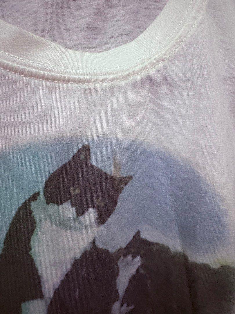 Cat Baby Tee (SHEIN) (Category: Shirts) located in San Mateo. Submitted by piscesdotcom (Listing ID 1368942267, Image 2). Description: size xs-s has stain (check 2nd photo) cutest fit and design rfs: too many white tops mop: gcash mod: ggx / lalamove.