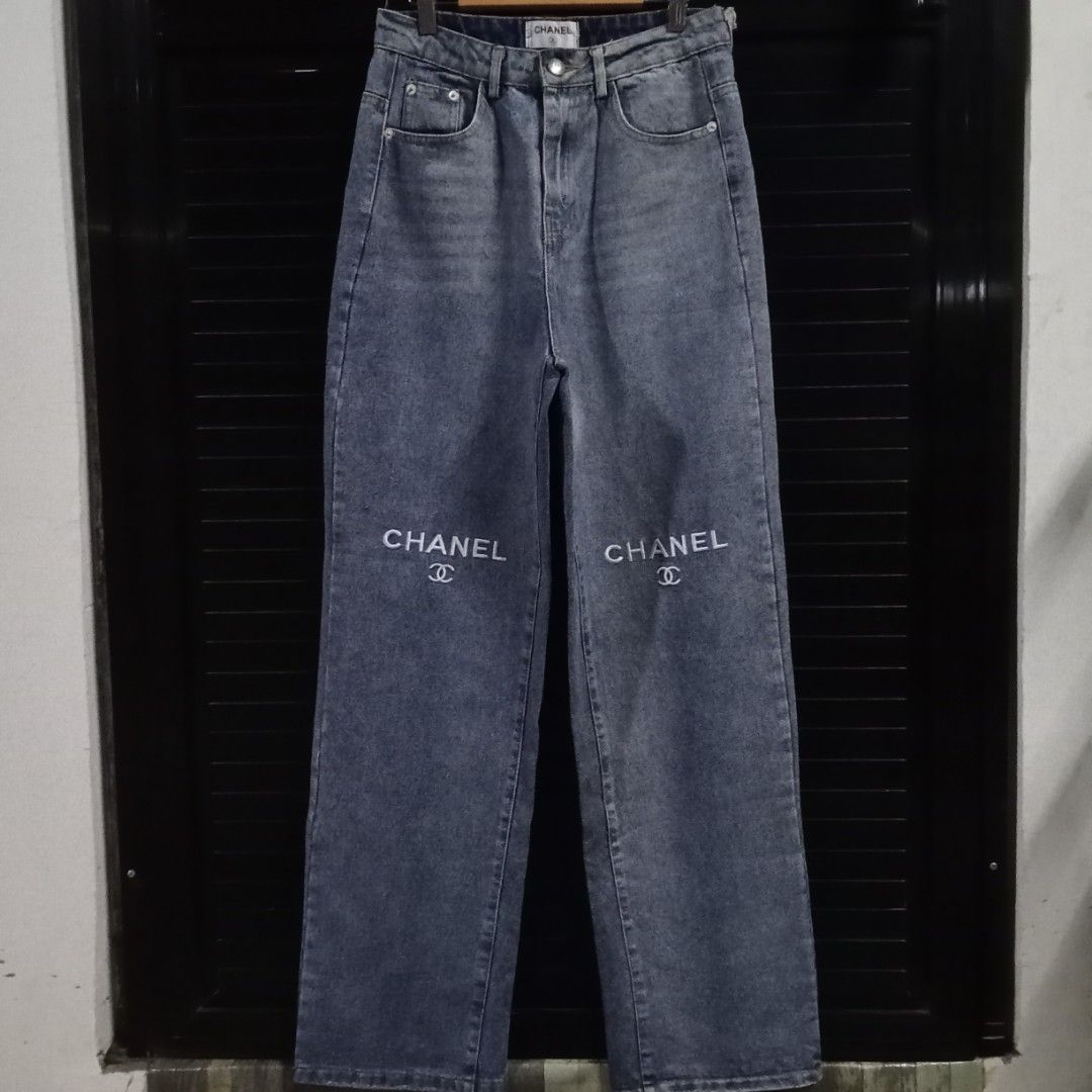 Chanel Embroided Denim Pants (Category: Luxury Apparel) located in Angeles City. Submitted by hoely.faith (Listing ID 1368821769, Image 2). Description: AUTHENTICITY N0T GUARANTEED‼️ BUY AT YOUR OWN RISK‼️ details: - embroided chanel on knee part - engraved brand name on button - semi hard denim condition: excellent condi. color rate: 9/10 issue/s: FLAT LAID DIMES: waistline size (in): 26 via tape measure rise length: 12 leg hole: 8.5 length: 43 