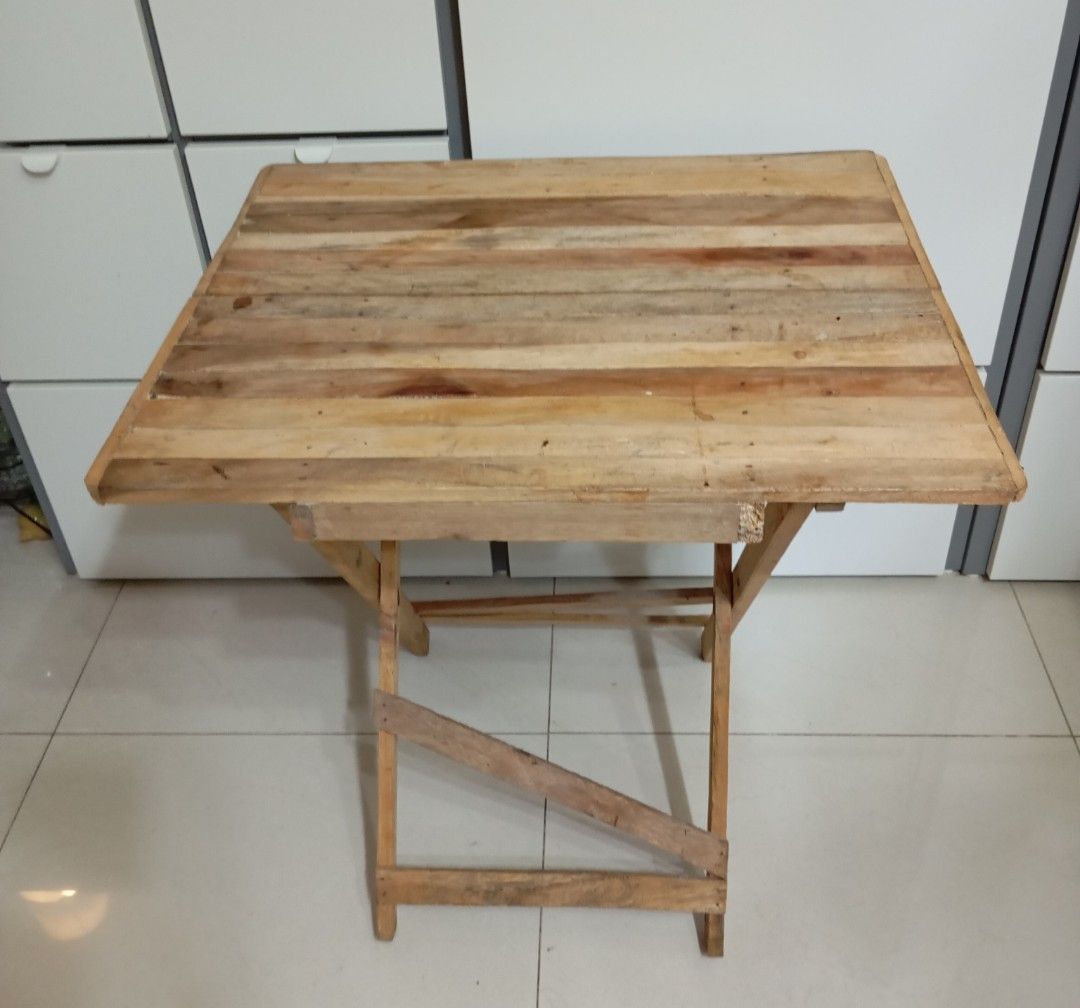 Folding table Wood (Category: Tables & Sets) located in San Juan City. Submitted by maias.secret (Listing ID 1368926309, Image 1). Description: * This folding table. * This item is slightly used upon selling it . * Good condition and good quality. * Can be used as a study table, dining table, booth table, etc. * Size : 24 inches by 20 and 1/2 inches (Top table) * Height; 25 inches. *With free. * Reason for selling; De clutter. * Payment through B