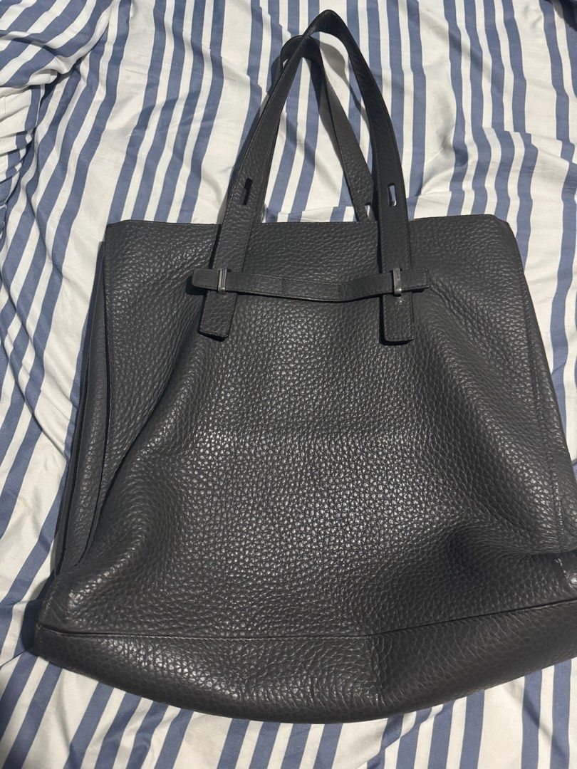 Furla Giove Tote (Category: Luxury Bags & Wallets) located in Mandaluyong City. Submitted by ericrn (Listing ID 1368786912, Image 2). Description: With small rubs at the bottom part. Please see the last 2 pictures. [Specifications] Open closure 1 outer pocket (open type) 5 inner pockets (zipper type, open type) 1 pen stab 1 D-ring [Material] Calfskin [Color name] NERO [Hardware] Silver [Size] Length 35.5cm x width 38cm x gusset 14cm Handle: 40.4c