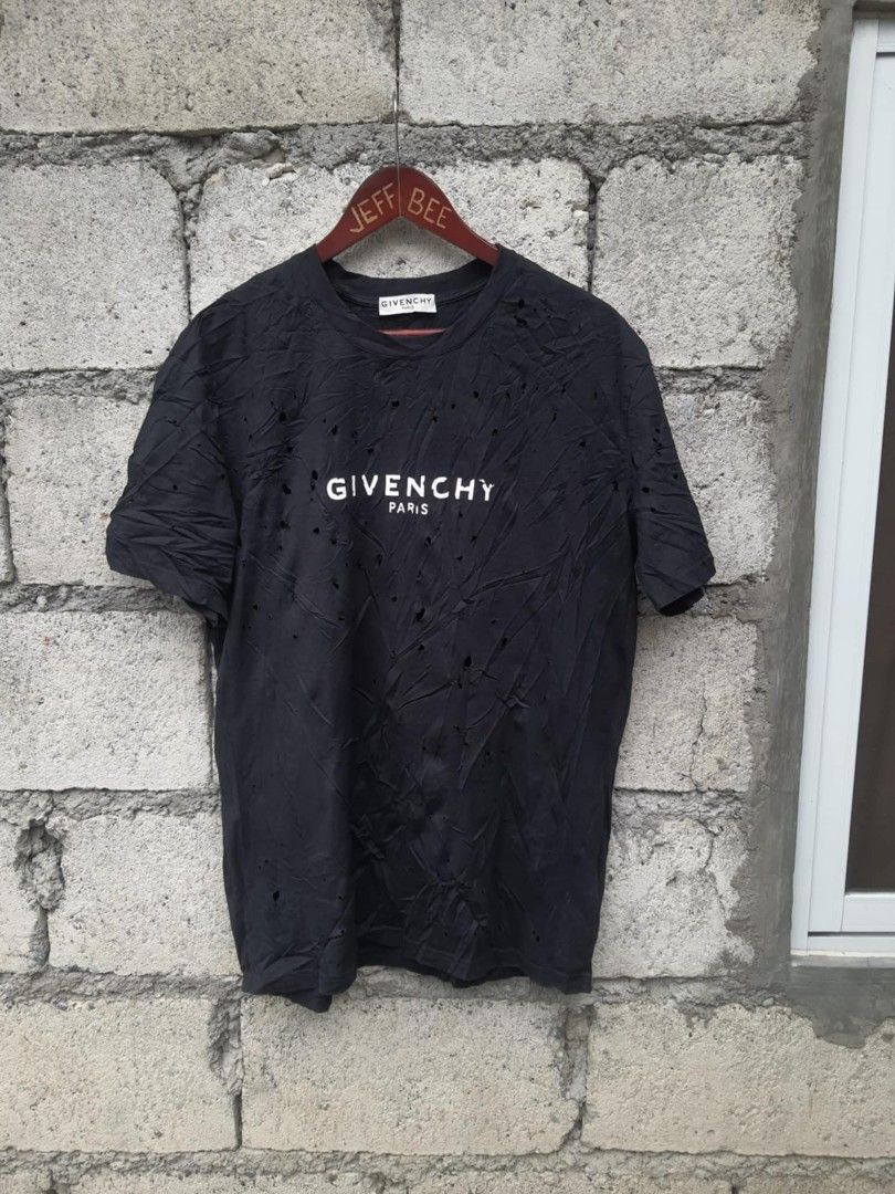 Givenchy destroyed t shirt like new (Category: Luxury Apparel) located in Bayombong. Submitted by jeffbeeer (Listing ID 1368906611, Image 1). Description: small on tag oversize fits xl men 2xl womens 29 length 23 width GOOD AS NEW 💯.