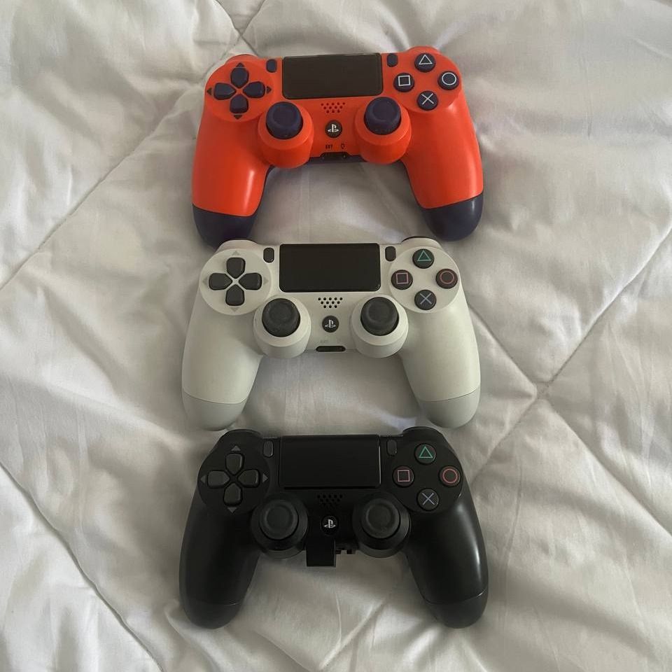 PS4 Controller (Category: PlayStation) located in Singapore. Submitted by artan_leiqunix (Listing ID 1368824839, Image 1). Description: im selling away used ps4 controller which is all function and fully working - PS4 (White) $30 - PS4 (Orange Blue) $30 (SOLD) - PS4 (Black with Back Paddle) $35.