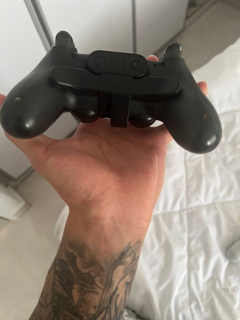 PS4 Controller (Category: PlayStation) located in Singapore. Submitted by artan_leiqunix (Listing ID 1368824839, Image 2). Description: im selling away used ps4 controller which is all function and fully working - PS4 (White) $30 - PS4 (Orange Blue) $30 (SOLD) - PS4 (Black with Back Paddle) $35.