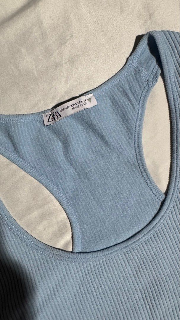 Zara Light Blue Racerback Crop Top (Category: Sleeveless) located in Pasig City. Submitted by getitfromg (Listing ID 1368892551, Image 2). Description: Original Zara with minimal stains (as seen in pics) XS-S.