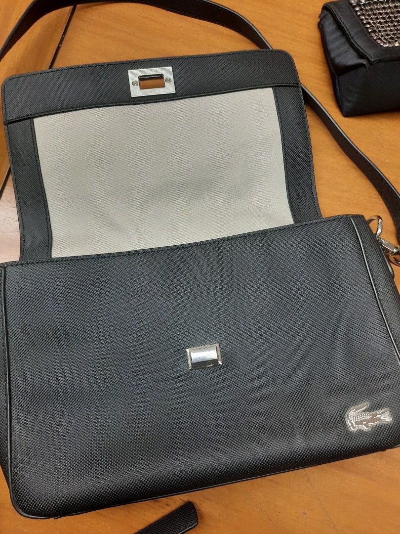 [ 💯 authentic] Lacoste Flap Cross-body Bag black (Category: Cross-body Bags) located in Las Pinas. Submitted by lbays_mint (Listing ID 1345948768, Image 2). Description: get yours, preloved item Lacoste Cross-body flap bag 🎒 Bought in local Lacoste stores 💯 authentic ..condition 9/10👍 with key chain plus dust bag size: 27 x 19cm.