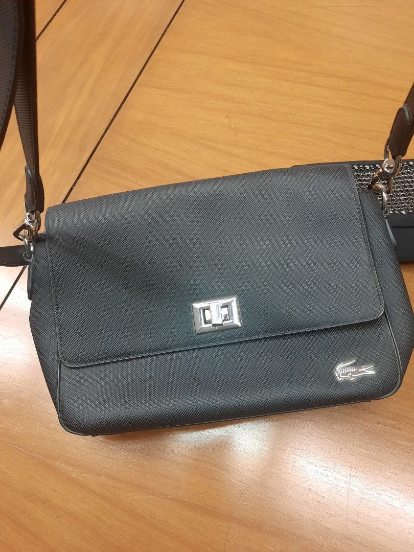 [ 💯 authentic] Lacoste Flap Cross-body Bag black (Category: Cross-body Bags) located in Las Pinas. Submitted by lbays_mint (Listing ID 1345948768, Image 3). Description: get yours, preloved item Lacoste Cross-body flap bag 🎒 Bought in local Lacoste stores 💯 authentic ..condition 9/10👍 with key chain plus dust bag size: 27 x 19cm.