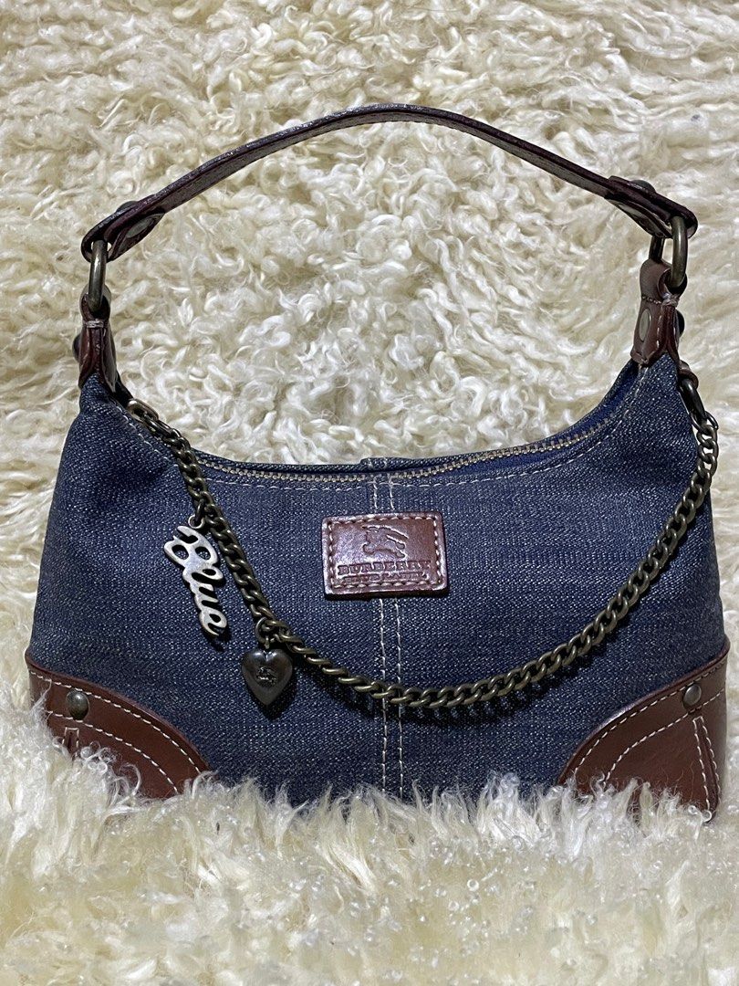 Authentic Burberry Blue Label Denim Mini Shoulder Bag (Category: Luxury Bags & Wallets) located in Rosario. Submitted by myvinatgepieces (Listing ID 1369099364, Image 2). Description: Rare Authentic Burberry Denim Mini Pouch Shoulder bag Looks New With minimal signs of wear Intact Tag Size: Height: 15cm Width: 33cm Depth: 13cm Handle Drop: 15cm .