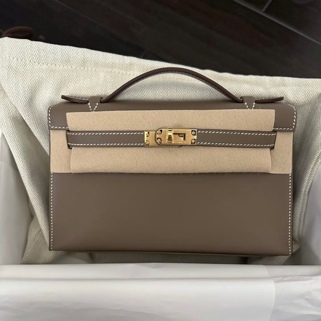 Authentic Hermes Kelly Pochette Etoupe GHW (Category: Luxury Bags & Wallets) located in Quezon City. Submitted by breakmyfashion (Listing ID 1369035356, Image 1). Description: Comes in full set with receipt, box, paperbag and dust bag. Stamp: K.