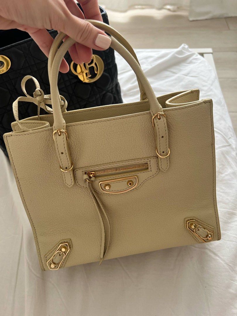 Balenciaga A4 Papier Tote Bag (Category: Luxury Bags & Wallets) located in Santa Rosa. Submitted by closetbykenny (Listing ID 1369054338, Image 1). Description: •Light Yellow. Gold Hardware. Comes with strap, dustbag, card and mirror. • Same size as Louis Vuitton On the Go BB. MOP: GCASH & MAYA MOD: J&T/LALAMOVE LOCATION: SANTA ROSA LAGUNA.