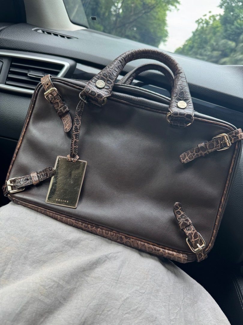 CELINE Brown Calf leather satchel with stamped crocodile details (Category: Bags & Wallets) located in Singapore. Submitted by yuki_ya (Listing ID 1369038559, Image 1). Description: Authentic Vintage Collectable Rare Celine Brown Crocodile Leather Zip Handbag. Unique trunkette shape with expandable sides/latches. Hardware marked CELINE as well as inside leather flap with code CE00/35 embossed on reverse. Purse is smooth leather with embossed croc