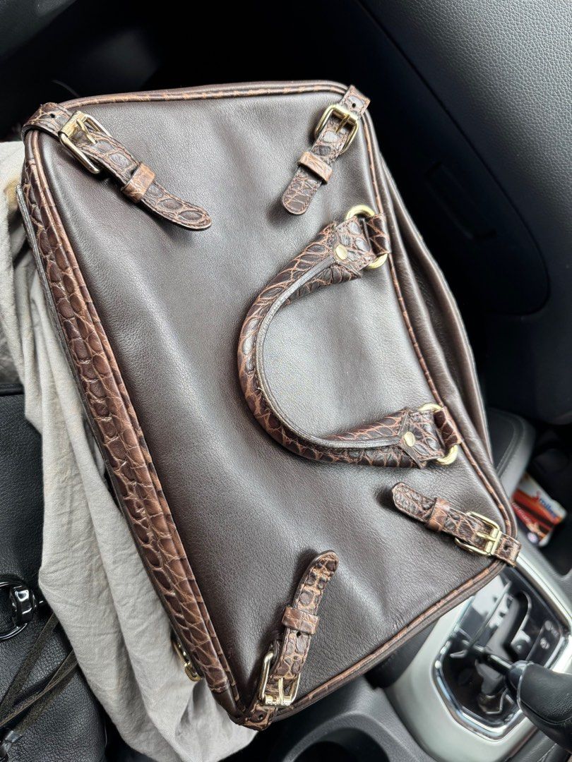 CELINE Brown Calf leather satchel with stamped crocodile details (Category: Bags & Wallets) located in Singapore. Submitted by yuki_ya (Listing ID 1369038559, Image 2). Description: Authentic Vintage Collectable Rare Celine Brown Crocodile Leather Zip Handbag. Unique trunkette shape with expandable sides/latches. Hardware marked CELINE as well as inside leather flap with code CE00/35 embossed on reverse. Purse is smooth leather with embossed croc