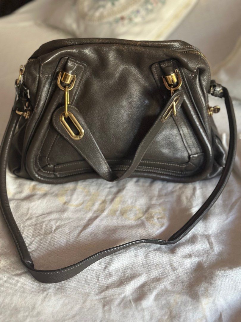 Chloe Medium Paraty (Rock) (Category: Luxury Bags & Wallets) located in Muntinlupa City. Submitted by cooniescloset (Listing ID 1369034178, Image 1). Description: Barely used and kept in storage. Has noticeable leather wear around zipper closure but otherwise great condition. Color: Rock (deep green/gray) Material: Calfskin Leather Dimensions: 37 cm × 12.5 cm × 28 cm (14.6 × 4.9 × 11.0 in) Handle drop: 13 cm (5.1 in) Strap length: 47 cm (18.5 in)