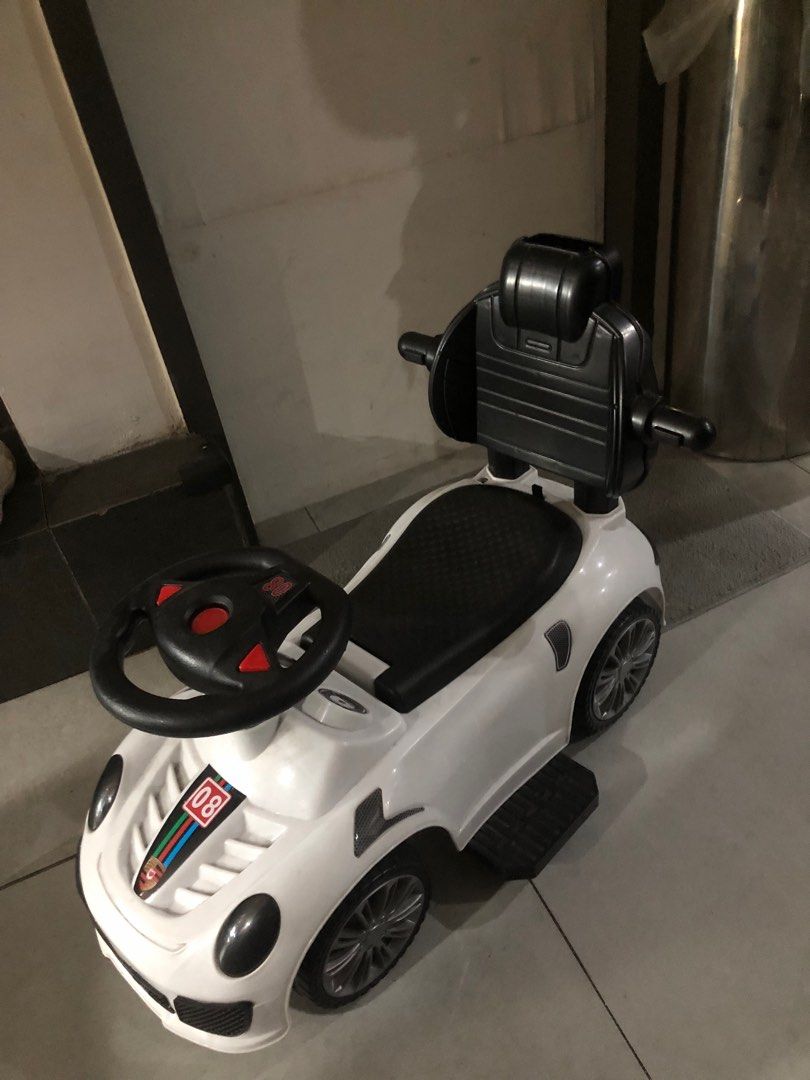 White Car for Baby/Kid (Category: Infant Playtime) located in Manila. Submitted by artsygunda (Listing ID 1369052238, Image 3). Description: Good condition Sold as is With lights and sounds (but havent tried again if it's working) With handle but has been misplaced .
