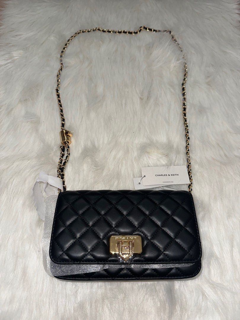 Charles & Keith Cressida Quilted Clutch (Black) (Category: Shoulder Bags) located in Antipolo. Submitted by bhrl__48 (Listing ID 1369137986, Image 1). Description: - BRAND NEW - Bought for ₱2,999 - comes with tag and dust bag - see photos for product dimensions.