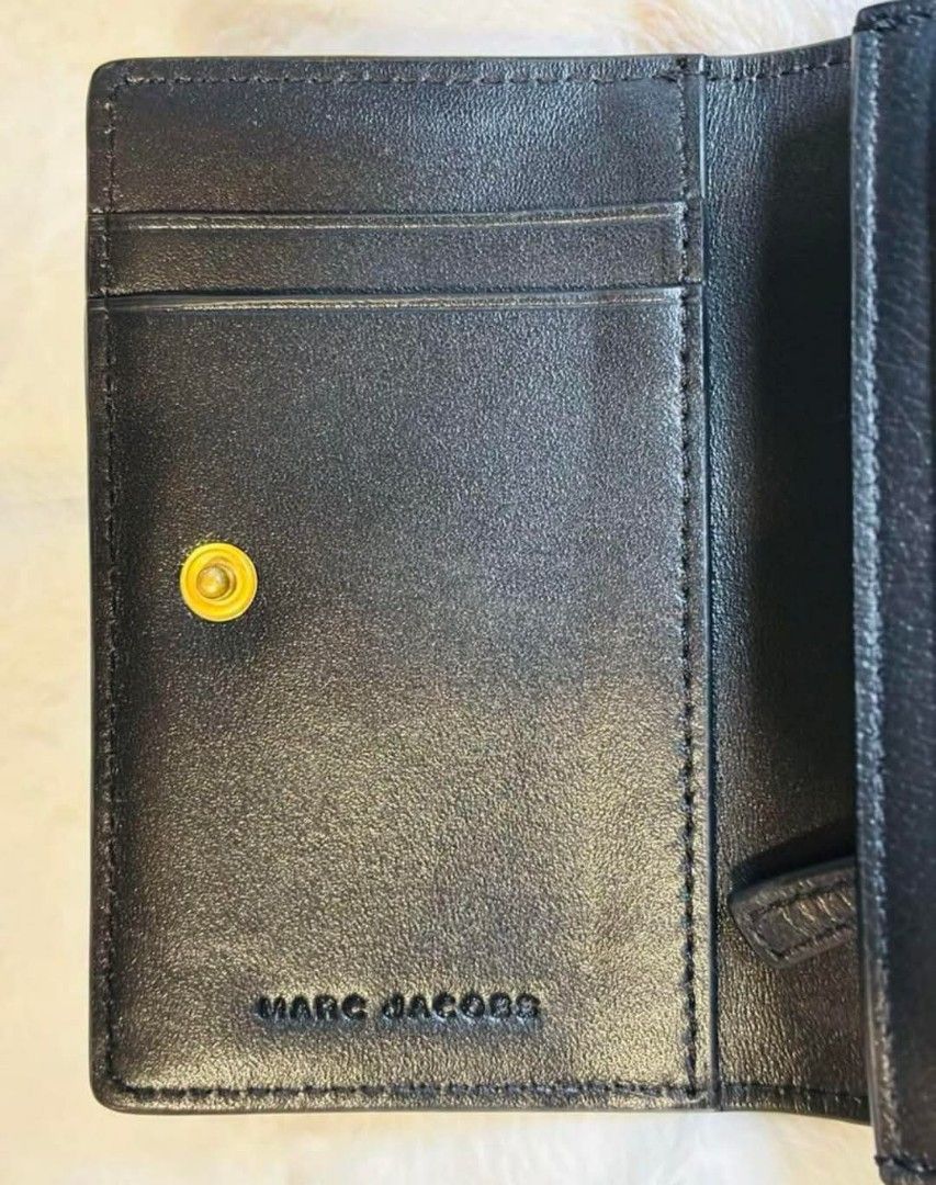 MJ (Category: Luxury Bags & Wallets) located in Bulacan. Submitted by vintage_purge (Listing ID 1369155338, Image 3). Description: mj 3400php Size: Approximately 11.5cm wide, 8cm tall, 2.5cm thick Color: Black Material: Leather Includes a coin pocket, card holder, and pass case. It is not brand new it is in excellent condition with no scratches or scuffs. There are no scratches on the leather part. The plastic part of the pass case shows some sig