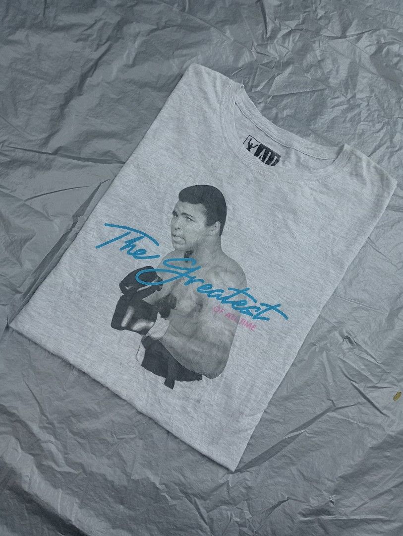 Muhammad Ali G.O.A.T shirt (Category: Formal Shirts) located in Pili. Submitted by purestuffph (Listing ID 1369193156, Image 1). Description: Muhammad Ali shirt size: 2XL on tag (Large to XL actual fitting) width: 21.5 length: 28-29 350 + shipping fee.