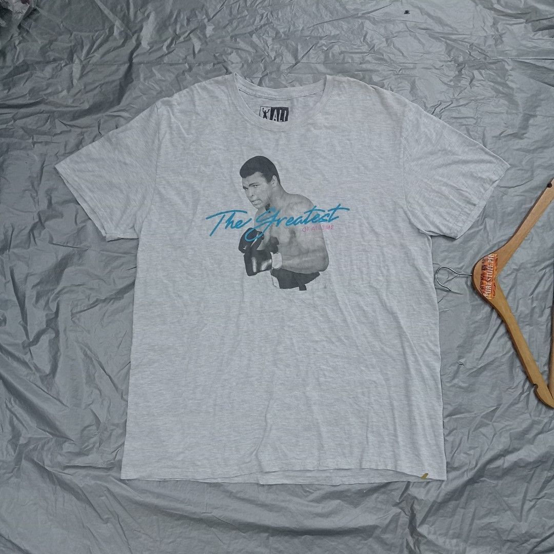 Muhammad Ali G.O.A.T shirt (Category: Formal Shirts) located in Pili. Submitted by purestuffph (Listing ID 1369193156, Image 3). Description: Muhammad Ali shirt size: 2XL on tag (Large to XL actual fitting) width: 21.5 length: 28-29 350 + shipping fee.