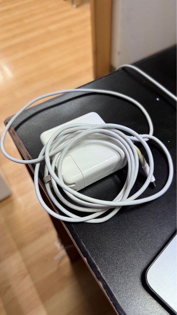 Original Macbook USB C cord and adapter (Category: Chargers) located in Manila. Submitted by daisydeclutters (Listing ID 1369148556, Image 2). Description: Original Macbook USB C cord + adapter. Not being used so will sell instead. No issues apart from the slight yellowing on the ends of the cord. :).