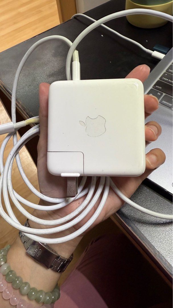 Original Macbook USB C cord and adapter (Category: Chargers) located in Manila. Submitted by daisydeclutters (Listing ID 1369148556, Image 1). Description: Original Macbook USB C cord + adapter. Not being used so will sell instead. No issues apart from the slight yellowing on the ends of the cord. :).