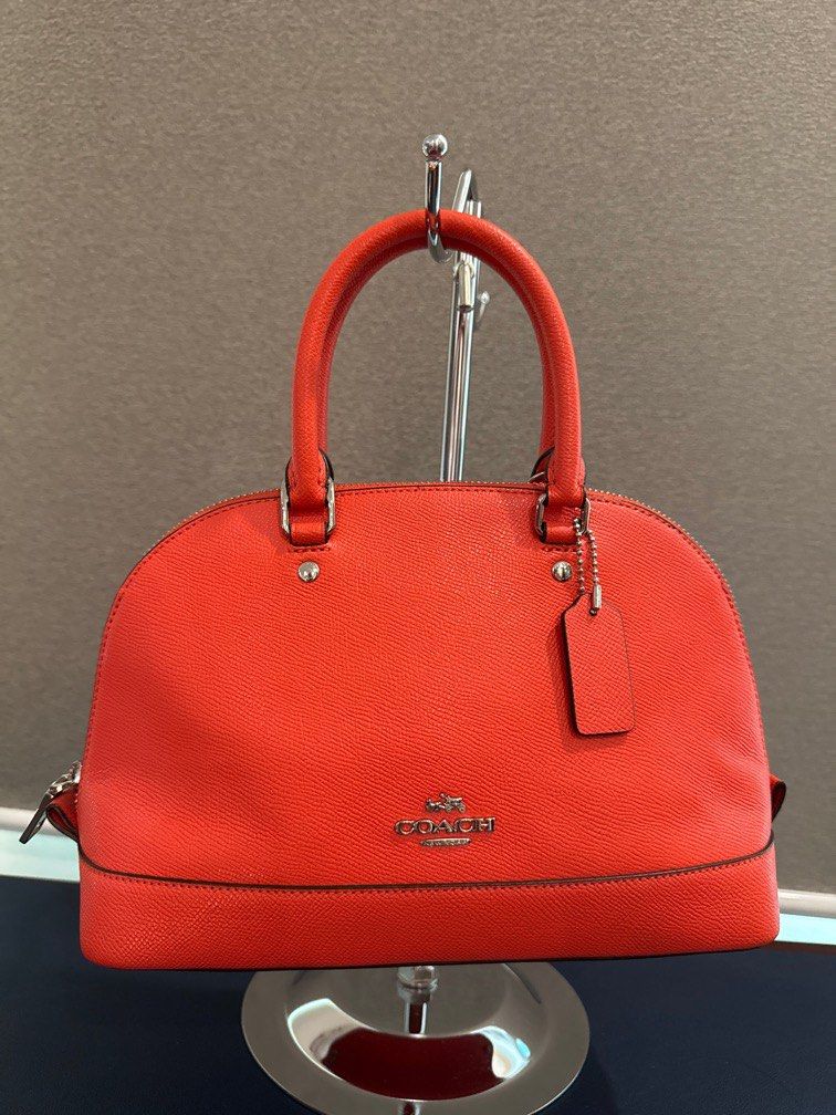 Authentic Coach Mini Sierra Satchel (Category: Luxury Bags & Wallets) located in Quezon City. Submitted by katharus (Listing ID 1369405053, Image 1). Description: personal use very clean issue: peeling of the leather patch creed tag inside the bag (pls see photo for details) - a common problem of coach stored in humid climates Color: red orange Material: crossgrain leather Closure: Zip closure Linning : fabric lining Handles: Double handles with 