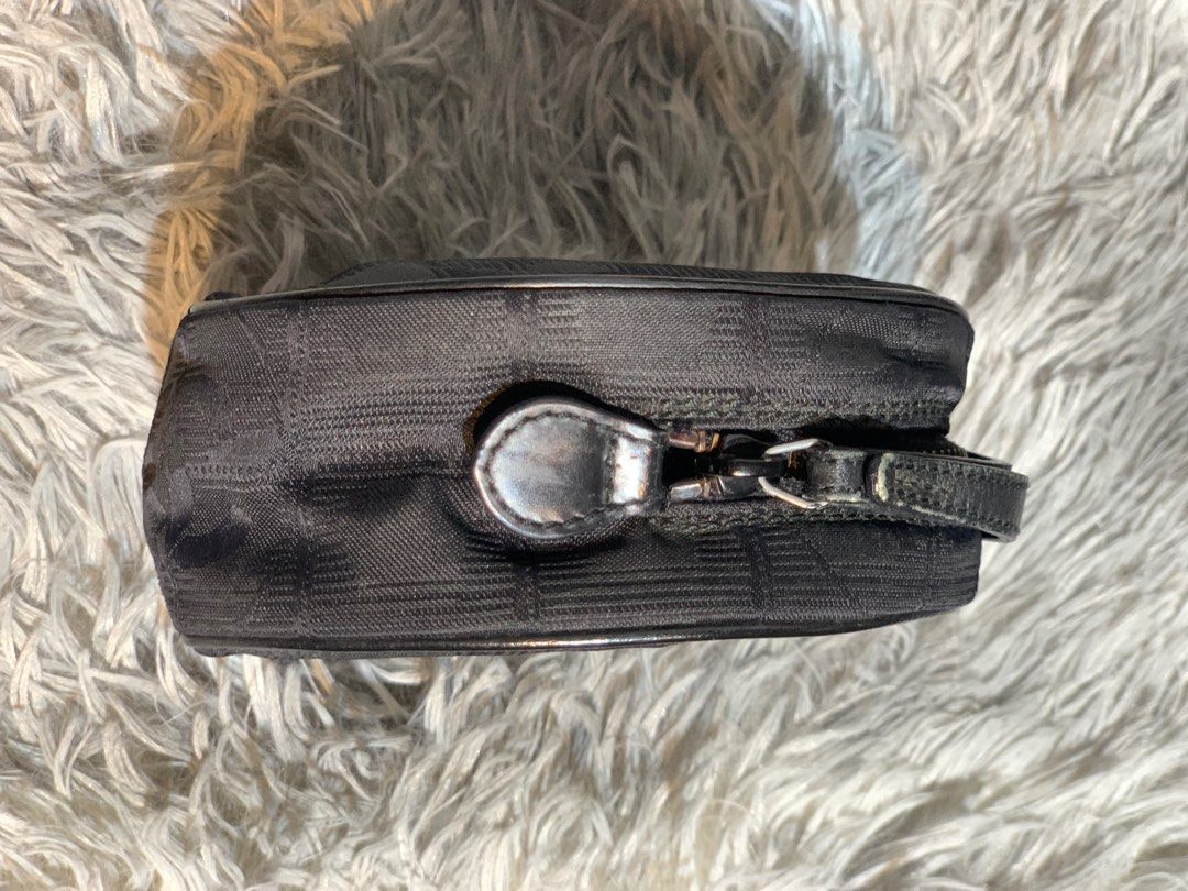 CHANEL JACQUARD NYLON ROUND POUCH (Category: Luxury Bags & Wallets) located in Pasig City. Submitted by anne902408 (Listing ID 1369352749, Image 3). Description: AUTHENTIC CHANEL JACQUARD NYLON ROUND POUCH ✅ NO FLAWS ✅MINIMAL SIGNS OF USE ✅MISSING HOLOGRAM BUT STILL VISIBLE FROM DETACHED ✅NO DUSTBAG ✅NO RETURN/EXCHANGE ℹ️ Chanel A17682 New Travel Line Round Pouch is a stylish accessory designed for practicality and elegance. Made from durable nyl