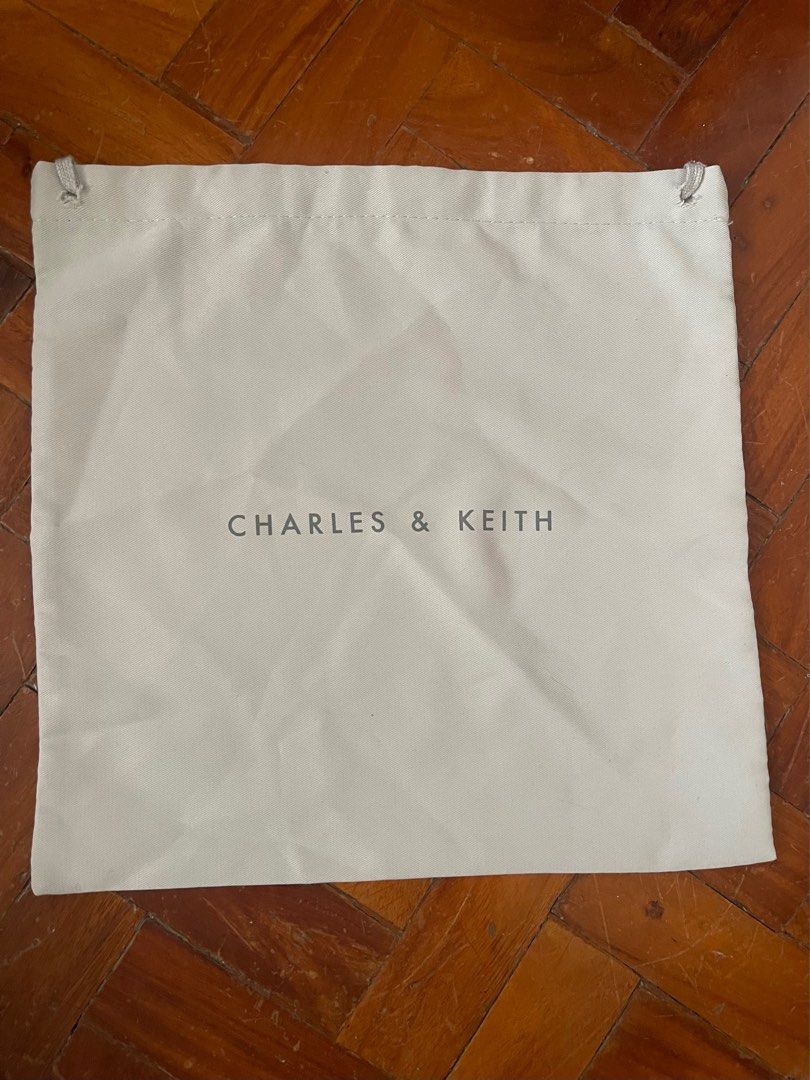 CHARLES AND KEITH - Crossbody Bag (Category: Cross-body Bags) located in Bacoor. Submitted by da.clutter (Listing ID 1369391852, Image 2). Description: - Bought from Charles&Keith (MOA Branch) in 2020 hence the old logo - With the bag and card - Price still negotiable !!!.