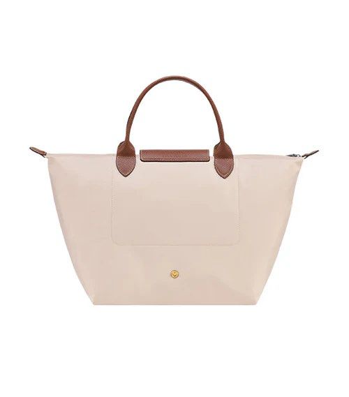Longchamp Le Pliage Original Top Handle Bag M Paper (Category: Luxury Bags & Wallets) located in Makati City. Submitted by shopluv.mnl (Listing ID 1369320025, Image 3). Description: - Needs cleaning - DM for actual pic - Comes with paperbag 💸 Mode of payment: Gcash / BPI bank transfer 🚚 Mode of delivery: Grab / Lalamove ONLY - Buyer to book after payment - Pin for reference: Version Salon and Spa, Floraville 📍 No return, no exchange - Please c