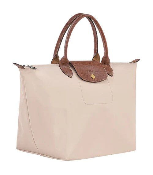 Longchamp Le Pliage Original Top Handle Bag M Paper (Category: Luxury Bags & Wallets) located in Makati City. Submitted by shopluv.mnl (Listing ID 1369320025, Image 2). Description: - Needs cleaning - DM for actual pic - Comes with paperbag 💸 Mode of payment: Gcash / BPI bank transfer 🚚 Mode of delivery: Grab / Lalamove ONLY - Buyer to book after payment - Pin for reference: Version Salon and Spa, Floraville 📍 No return, no exchange - Please c