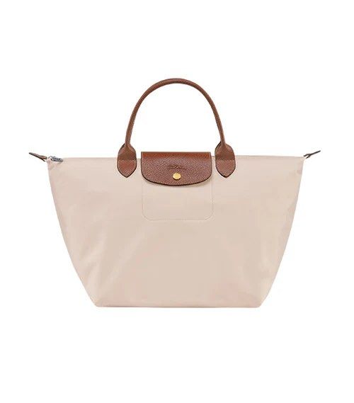 Longchamp Le Pliage Original Top Handle Bag M Paper (Category: Luxury Bags & Wallets) located in Makati City. Submitted by shopluv.mnl (Listing ID 1369320025, Image 1). Description: - Needs cleaning - DM for actual pic - Comes with paperbag 💸 Mode of payment: Gcash / BPI bank transfer 🚚 Mode of delivery: Grab / Lalamove ONLY - Buyer to book after payment - Pin for reference: Version Salon and Spa, Floraville 📍 No return, no exchange - Please c