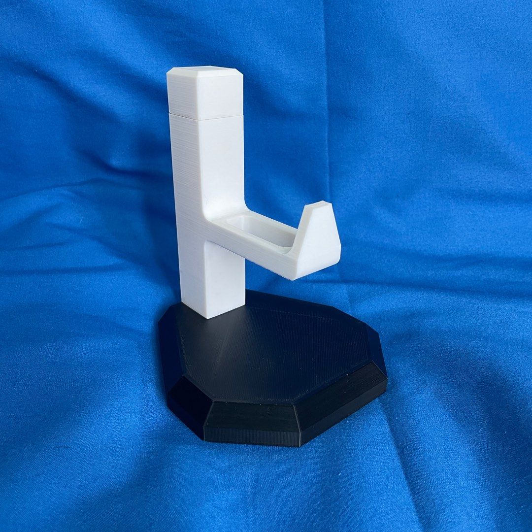 PS5 Controller Display (Category: Controllers) located in Singapore. Submitted by riezyy (Listing ID 1369370680, Image 3). Description: ‼️ Please read fully! ‼️ 3D Printed Gaming Controller Stand! (Controller not included) Dimensions: Stand: 110mm (d) x 110mm (l) x 135mm (h) Controller area: 60mm Weight: about 160g Additional information! Colours available (Last photo): - Black - White - Yellow - Red - Purple - Blue - Pink - Green Mix and match y