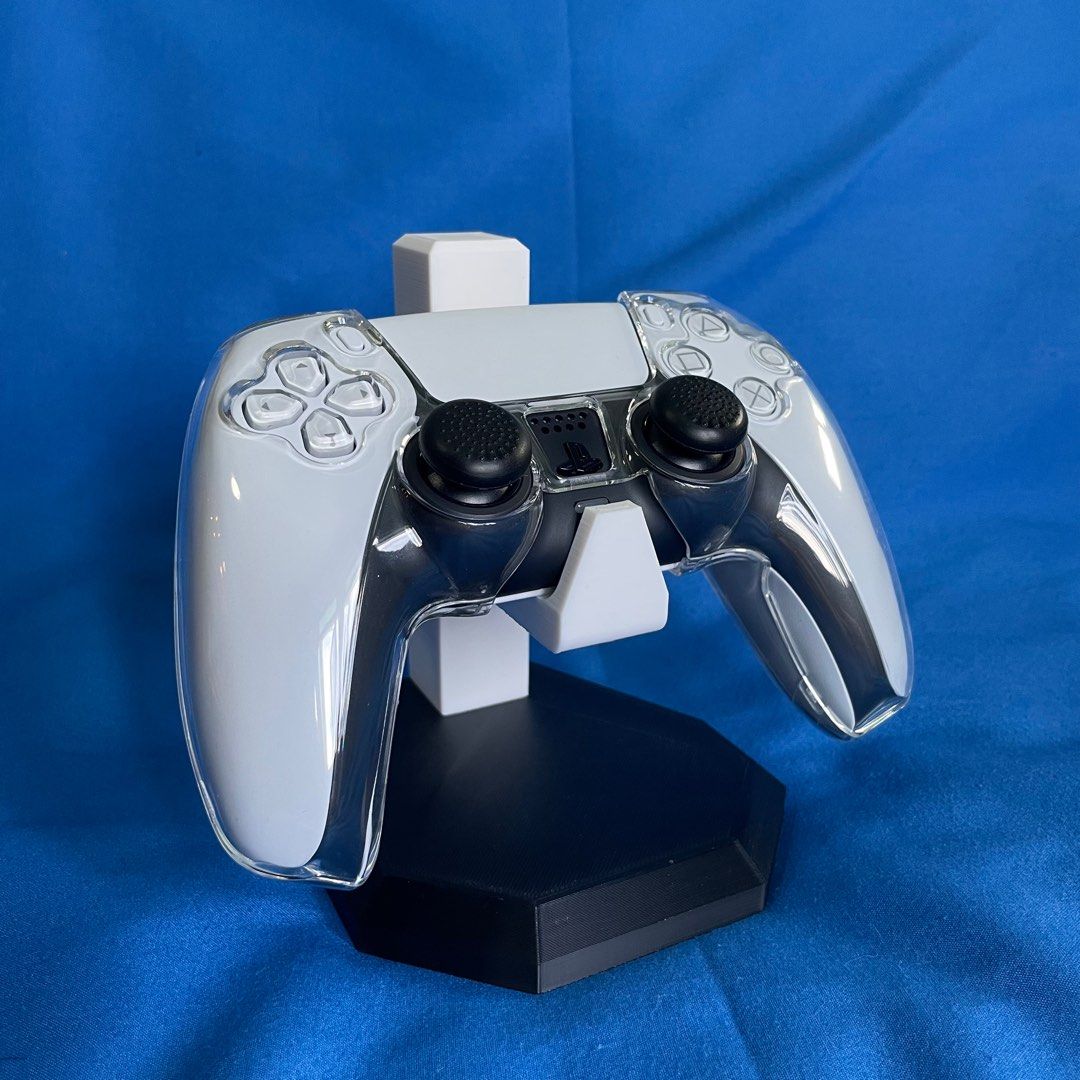 PS5 Controller Display (Category: Controllers) located in Singapore. Submitted by riezyy (Listing ID 1369370680, Image 2). Description: ‼️ Please read fully! ‼️ 3D Printed Gaming Controller Stand! (Controller not included) Dimensions: Stand: 110mm (d) x 110mm (l) x 135mm (h) Controller area: 60mm Weight: about 160g Additional information! Colours available (Last photo): - Black - White - Yellow - Red - Purple - Blue - Pink - Green Mix and match y