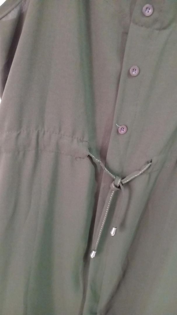 ZARA-inspired Olive Green Dress (Category: Dresses) located in Quezon City. Submitted by Alvinne (Listing ID 1369417587, Image 3). Description: Size - fits medium to Large Adjustable on waist Keep it cool and effortless in this olive green sleeveless jumpsuit dress. Designed with a flattering drawstring waist, button-front detail, and lightweight fabric, it’s perfect for warm days and easy layering. Just add sandals and you're good to go!.