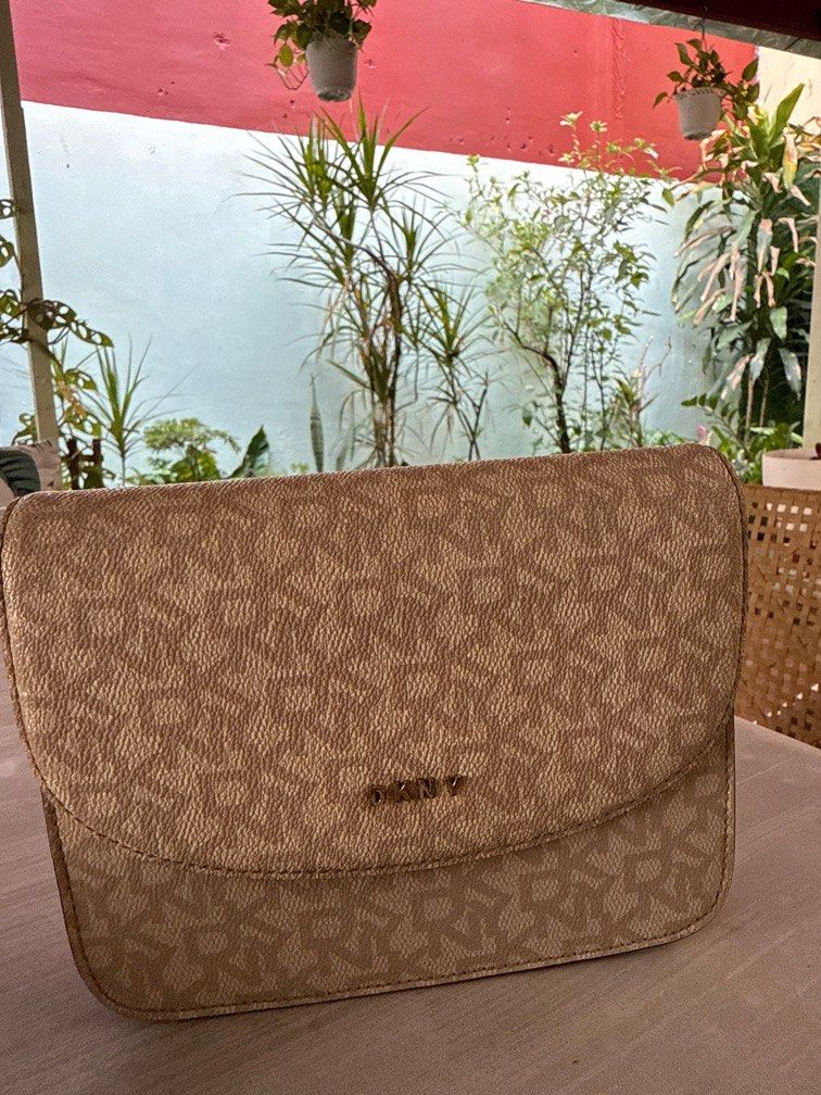 Original DKNY Sling bag beige color (Category: Clutches) located in Manila. Submitted by danipoli (Listing ID 1369509998, Image 1). Description: Original DKNY Sling bag Beige Preloved but not abused Can pass as brand new Rfs: decluttering .