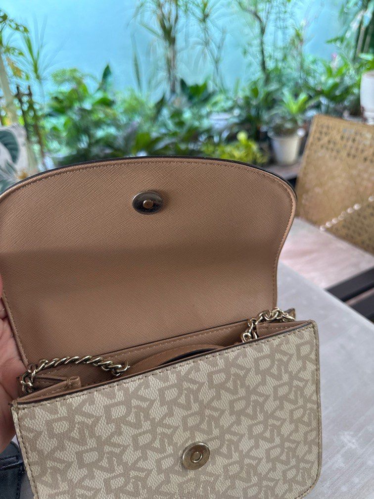 Original DKNY Sling bag beige color (Category: Clutches) located in Manila. Submitted by danipoli (Listing ID 1369509998, Image 3). Description: Original DKNY Sling bag Beige Preloved but not abused Can pass as brand new Rfs: decluttering .