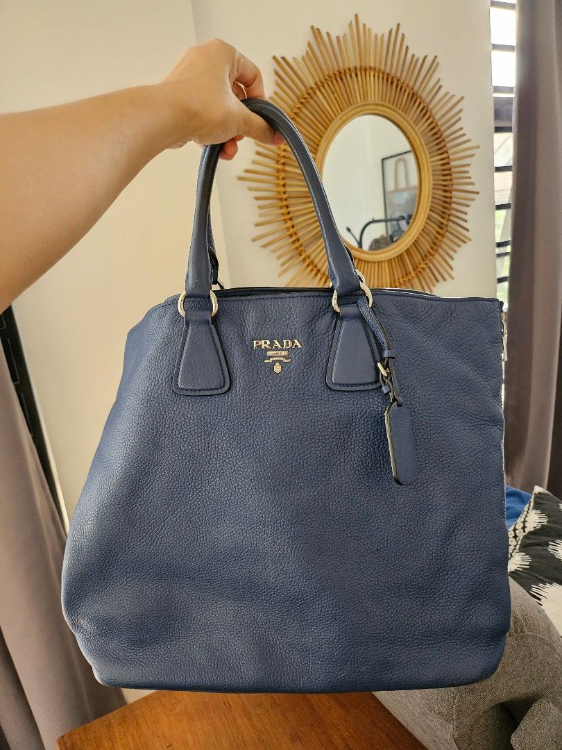 Prada Vitello Daino Leather Tote (Category: Luxury Bags & Wallets) located in Quezon City. Submitted by theclosetoptimist (Listing ID 1369510529, Image 1). Description: Will come with long strap and hangtag. No dustbag. Flaws: Corners scuffed (see photos), handles a bit sticky MOP: GCash, BPI, Maya.