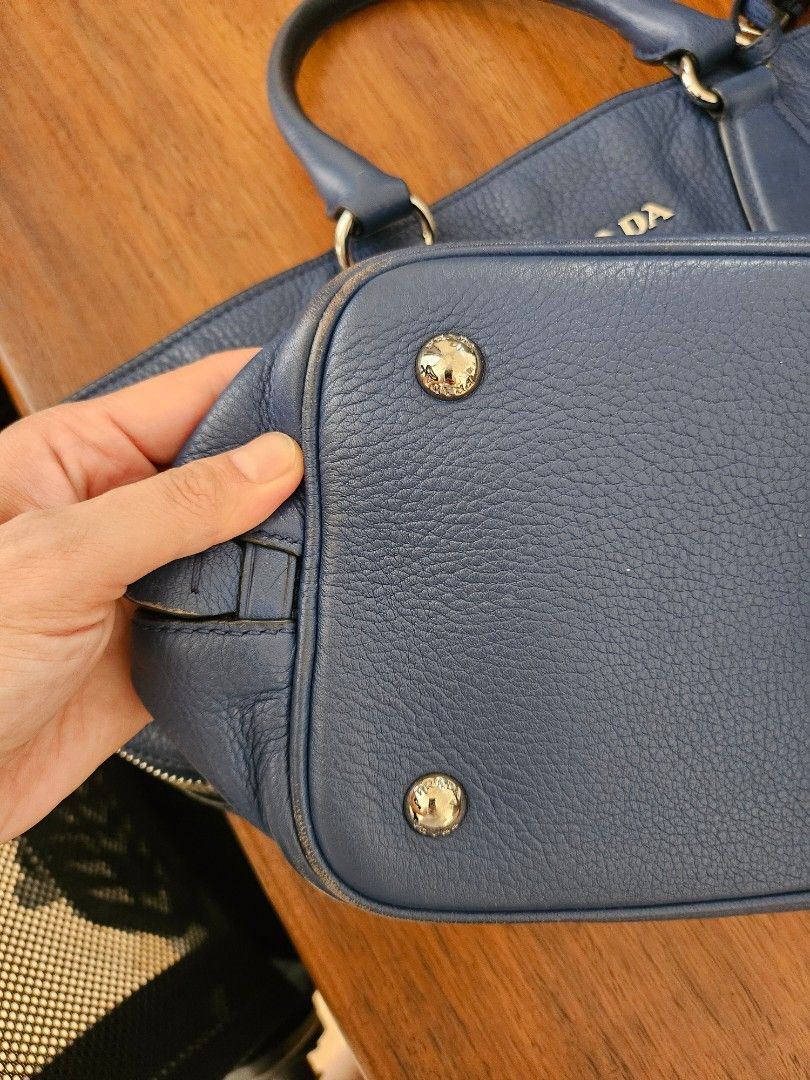 Prada Vitello Daino Leather Tote (Category: Luxury Bags & Wallets) located in Quezon City. Submitted by theclosetoptimist (Listing ID 1369510529, Image 3). Description: Will come with long strap and hangtag. No dustbag. Flaws: Corners scuffed (see photos), handles a bit sticky MOP: GCash, BPI, Maya.